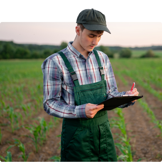Man with clipboard in field